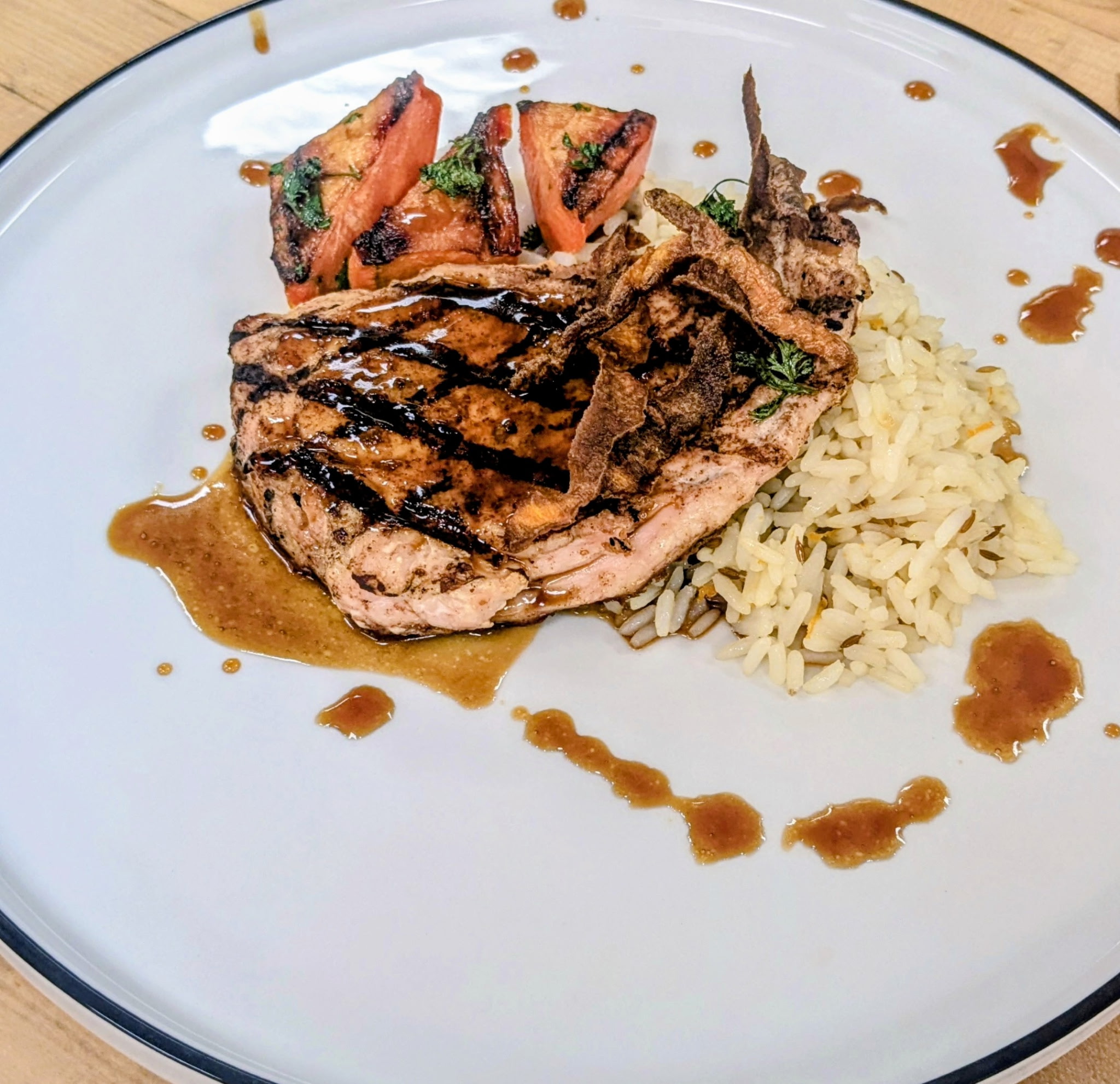 Grilled Pork Chop with Rice Pilaf and Charred Tomato